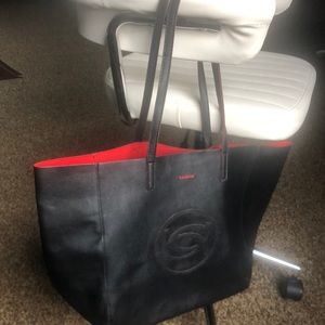 Bebe Tote Vintage NWOT Red logo and  trimmed around handles and inside bag